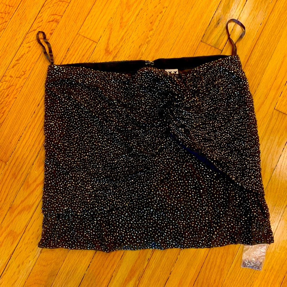Haute Hippie mini Skirt
Olive and Gold
Bead Embellishments
Zip Closure